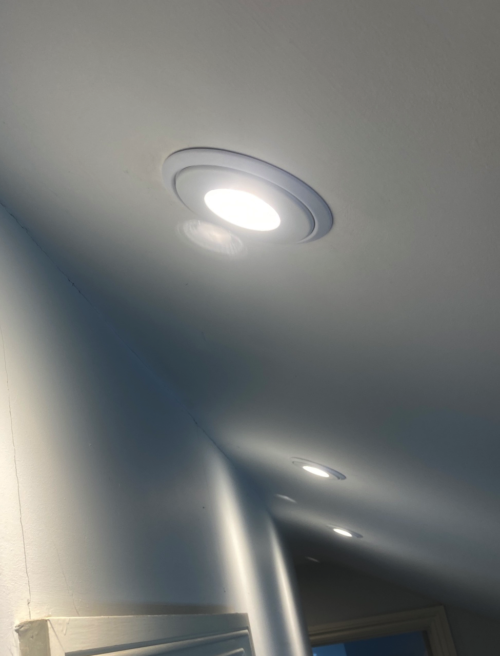 Integrate downlight with oversize ring to hide the hole
